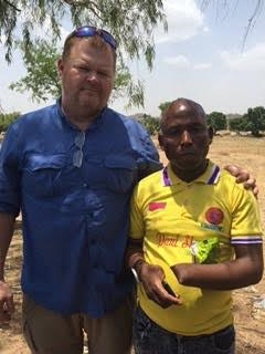 Brent Hail And Musa With His Missing Hand And Thumb.