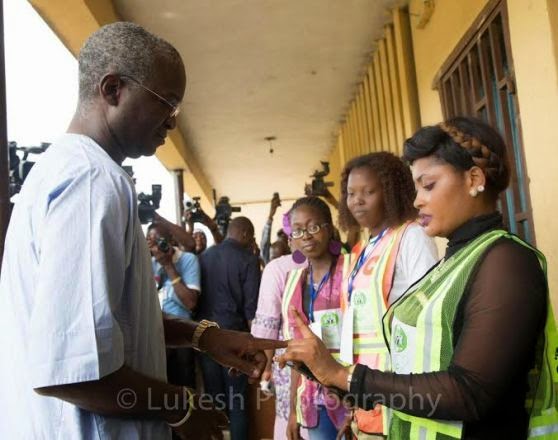 Governor of Lagos State, Raji Babatunde Fashola & his wife, Abimbola pictured getting accredited at his Polling Booth