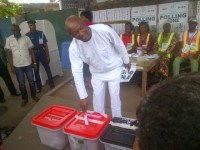 Photos of Jimi Agbaje casting his vote, while Tinubu waits in line to vote