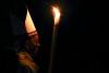Pope Francis holds a candle as he arrives to lead the Easter vigil mass in Saint Peter's basilica at the Vatican April 4, 2015.     REUTERS/Stefano Rellandini